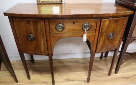 A George III mahogany bowfront and satinwood crossbanded sideboard W.117cm