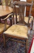 A set of seven Chippendale style mahogany dining chairs, one with arms