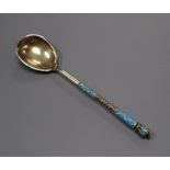 A Russian 84 zolotnik parcel gilt white metal and cloisonne turquoise enamel decorative spoon, 12.