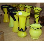 Nine yellow glass vases