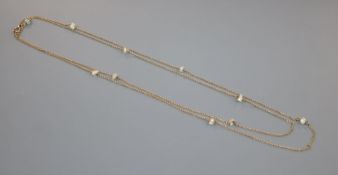 An early 20th century 15ct and baroque pearl set guard chain, 142cm, gross 18.4 grams.