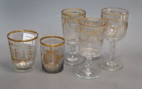 Three 19th century German gilt glass goblets and a similar tumbler