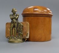 A small brass menu holder modelled as Napoleon and a miniature book, Napoleon's Book of Fate and a