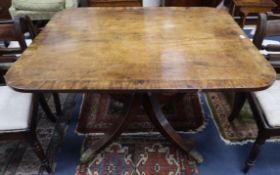 A Regency fiddle-back mahogany breakfast table, having rectangular rosewood cross-banded top with