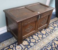 A small 17th century two-panel oak coffer W.90cm