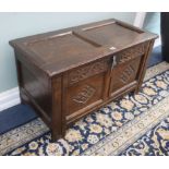 A small 17th century two-panel oak coffer W.90cm