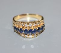 An 18ct gold sapphire and diamond triple row ring, size T