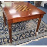 A George III style inlaid mahogany games table, with draughts and chessmen