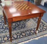 A George III style inlaid mahogany games table, with draughts and chessmen