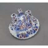 A 19th century Delft flask of shell form, decorated with figures and hunting scene