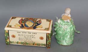 A Crown Devon musical box and pin cushion doll