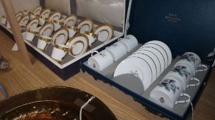 Two matching Royal Worcester gilt-bordered coffee sets and another Royal Worcester coffee set (3,