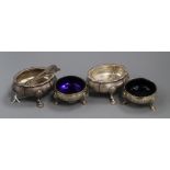 A pair of George III silver cauldron salts (blue glass liners), a pair of salt spoons and a pair