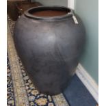 A gun metal glazed pottery garden urn H.84cm