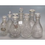 A group of Georgian glass decanters and three Regency japanned coasters