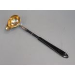 An antique German parcel gilt silver punch ladle, with ebonised handle