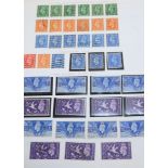 A collection of stamps in two albums, a stockbook and loose with mint and used Great Britain,