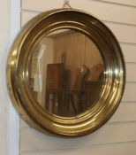 A circular metal framed wall mirror Diameter 56cm