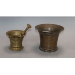 An 18th century bell metal mortar, with pestle and a similar smaller mortar