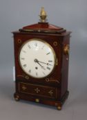 A William IV mahogany timepiece, having circular Roman enamelled dial, the cut brass-inlaid case