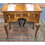 A George I style cross-banded and feather-banded walnut lowboy on cabriole legs H.75.5cm, W.76cm