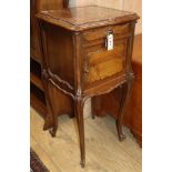 A Louis XV style walnut table de nuit having marble top over drawer and cupboard and a similar table