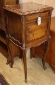 A Louis XV style walnut table de nuit having marble top over drawer and cupboard and a similar table