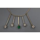 An 18ct white gold multiple drop necklace, set with an emerald and four diamonds