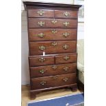 A George III mahogany chest on chest circa 1765, with original brass furniture on shaped bracket