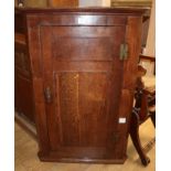 A George III oak hanging corner cupboard W.79cm