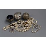 An Indian white metal three piece condiment set, three silver Scottish brooches, a garnet necklace