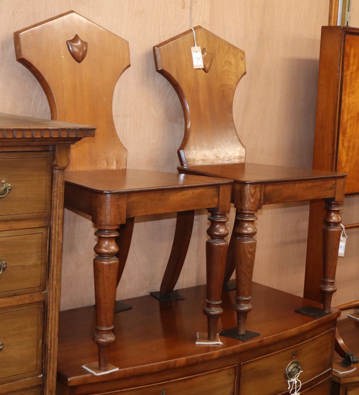 A pair of Victorian mahogany hall chairs