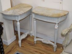 A pair of painted console tables with marble tops W.62cm