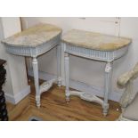 A pair of painted console tables with marble tops W.62cm