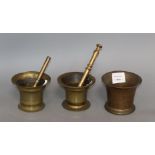 An 18th century brass mortar, 4.5in. and pestle, and two other brass mortars