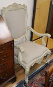 A pair of Louis XIV style large cream painted upholstered elbow chairs