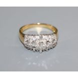 An 18ct gold brilliant and baguette diamond set dress ring, size U