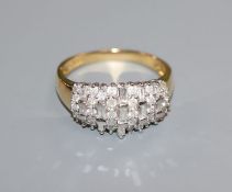 An 18ct gold brilliant and baguette diamond set dress ring, size U