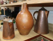 A late Bellarmine flagon and two large Victorian copper jugs flagon 34cm