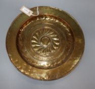A 17th century Nuremburg embossed brass alms dish diameter 41.5cm