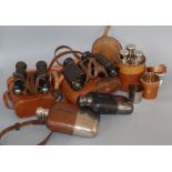 A set of leather-cased flasks, two pairs of binoculars, two spirit flasks and a set of leather-cased