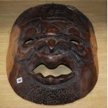 Three large carved Kenyan hardwood masks longest 70cm