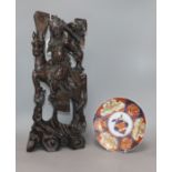 A Chinese carved hardwood figure of a warrior and an Imari plate height 46cm