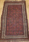 An Afghan dark brown ground rug 168 x 97cm
