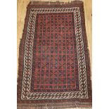 An Afghan dark brown ground rug 168 x 97cm