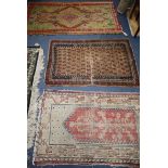 A Turkish green ground rug, 178 x 95cm, a worn runner and two other rugs