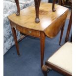 A George III mahogany oval pembroke table W.80cm