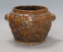 A Chinese brown glazed 'dragon', cockerel and deer' jar, 19th century height 17cm