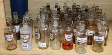 A collection of forty late Victorian chemist's dry drug jars and stoppers, with gilt framed named