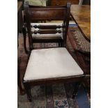 A set of three Regency mahogany dining chairs and a matching carver